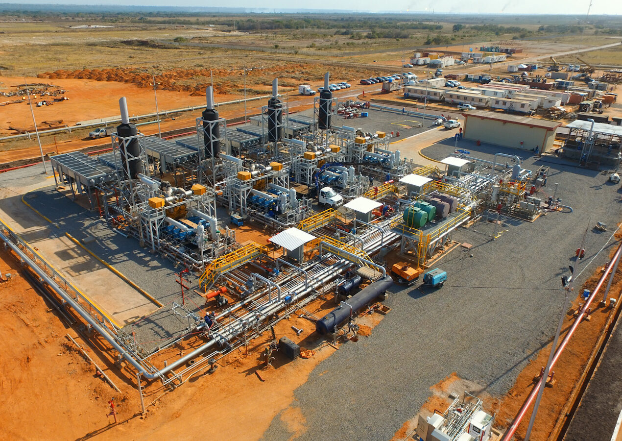 Aerial panoramic view of the infrastructure and foundations of a CH4 Systems engineering plant under development in a rural area.